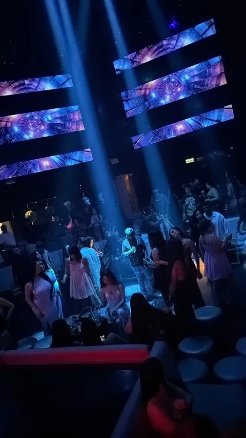Dance floor and guests beneath geometric LED display panels at Ora Club Dubai Night club