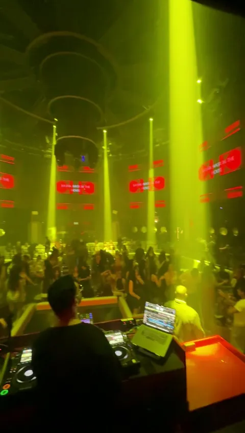 DJ console overlooking the main room dance floor in green stage lighting at Ora Club Dubai Night club